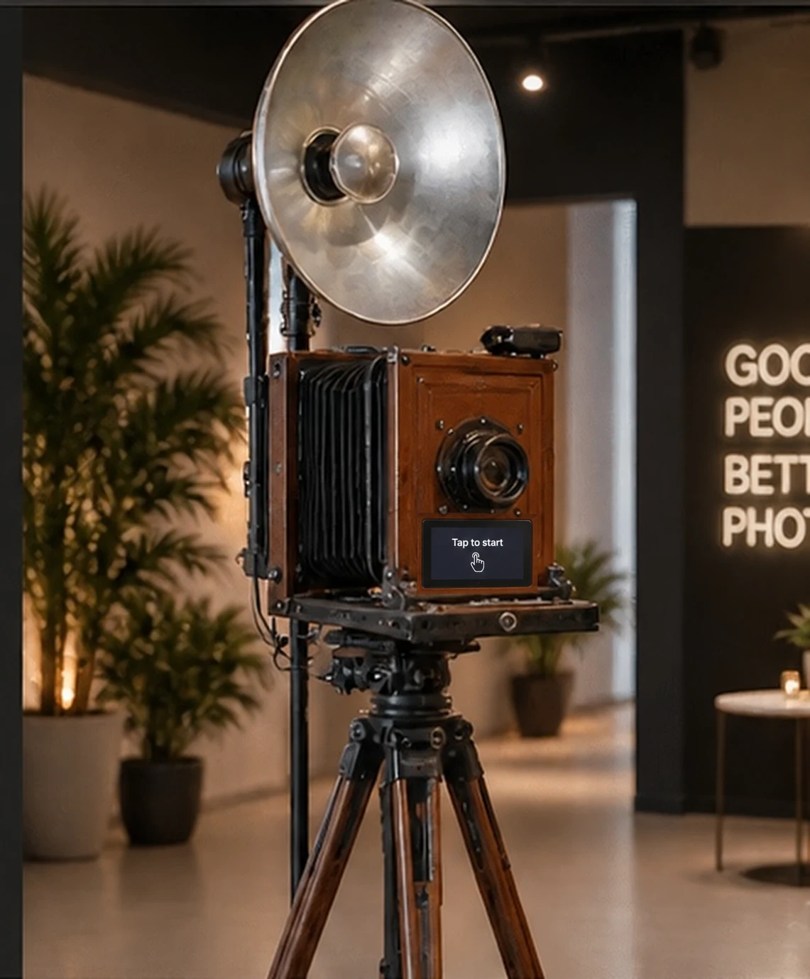 The vintage wooden camera photo booth with studio reflector and tall tripod
