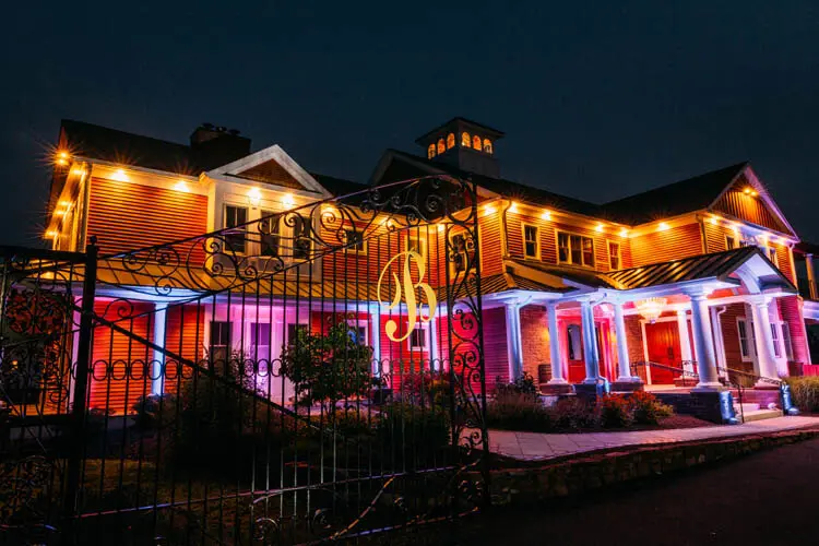 Colorful architectural lighting on a vineyard building after dark