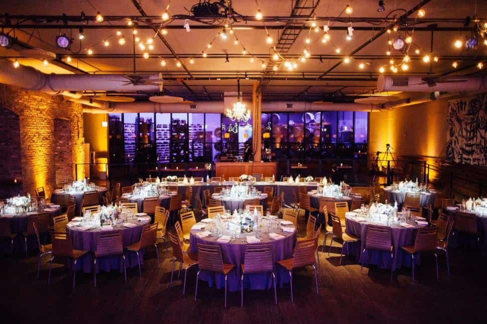 Warm amber light against stone walls at a reception